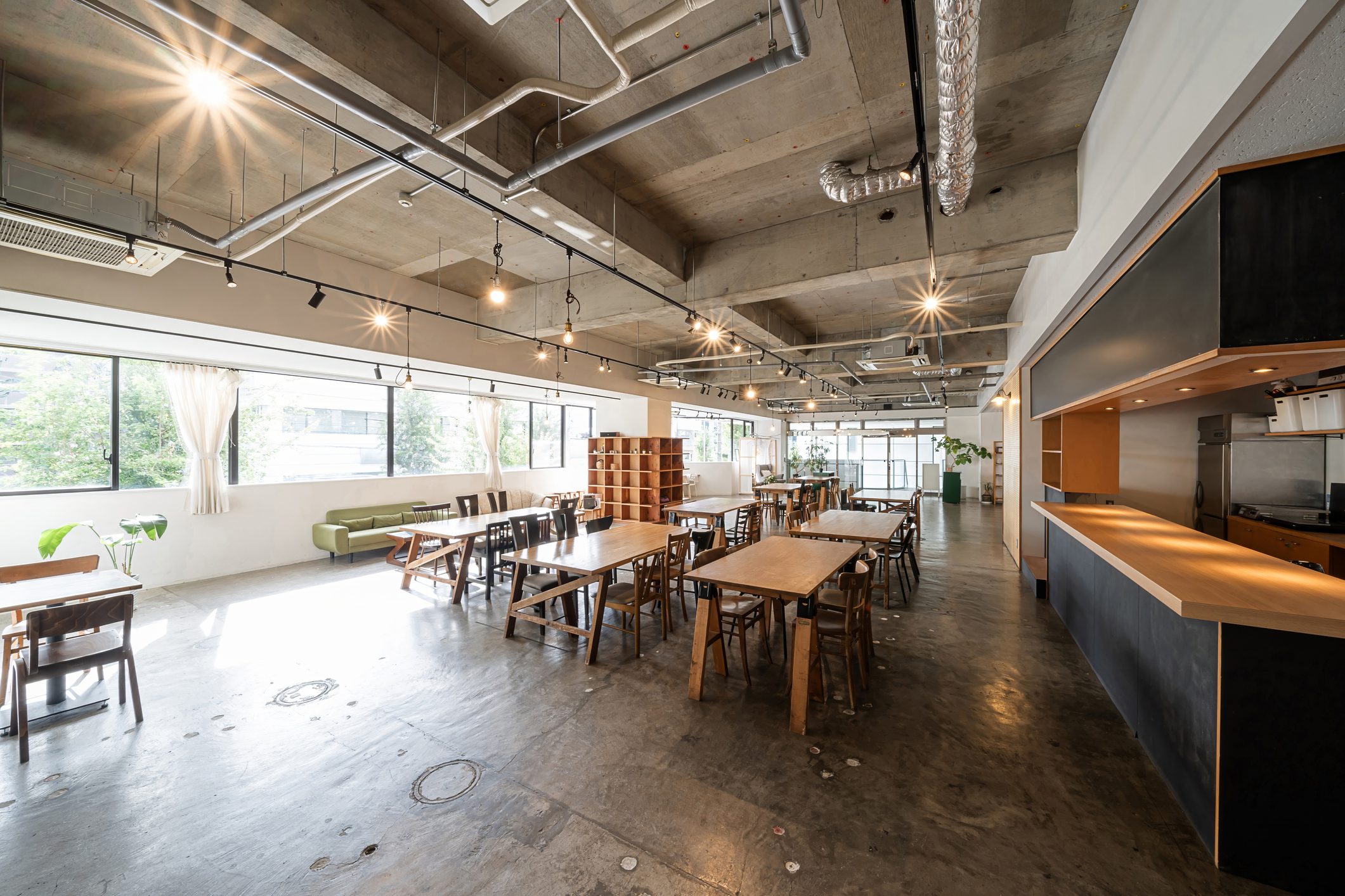 Spacious modern cafe with wooden furniture.